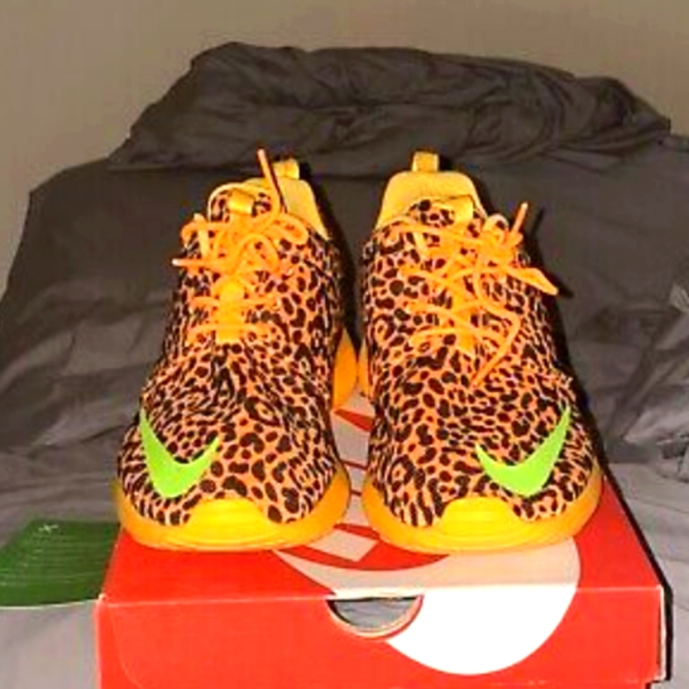 Orange and black leopard print Nike Roshe sneakers